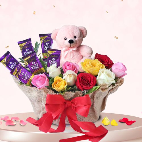 Gorgeous Display of Mixed Roses n Cadbury Dairy Milk with Teddy in Basket