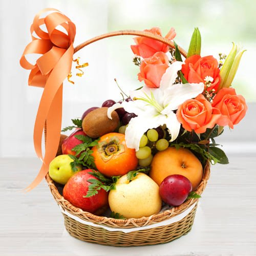 Decorative Imported Fruits Basket with Orange Roses n White Lily