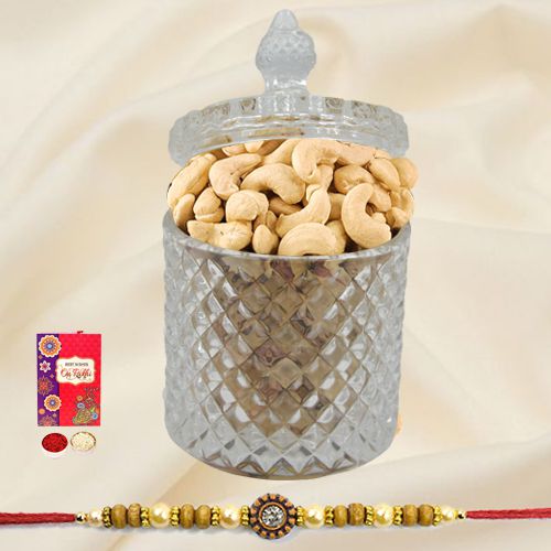 Crunchy Cashews in a designer Glass Jar with a Rakhi with free Roli Tilak Chawal